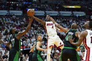 Miami Heat guard Victor Oladipo (4) drives to the basket as Boston Celtics guard Jaylen Brown (7) defends during the first half of Game 5 of the NBA basketball Eastern Conference finals playoff series, Wednesday, May 25, 2022, in Miami. (AP Photo/Lynne Sladky)