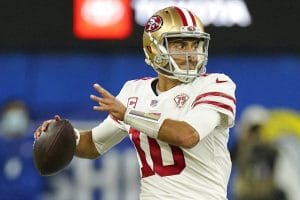 San Francisco 49ers' Jimmy Garoppolo looks to throw during the second half of the NFC Championship NFL football game against the Los Angeles Rams, Jan. 30, 2022, in Inglewood, Calif. Garoppolo expects his shoulder to be ready for training camp — wherever that may be. He told the AP Pro Football Podcast on Thursday, April 21, 2022, that his rehab is going well and it is helping him deal with uncertainty surrounding his future with the 49ers. (AP Photo/Mark J. Terrill, File)