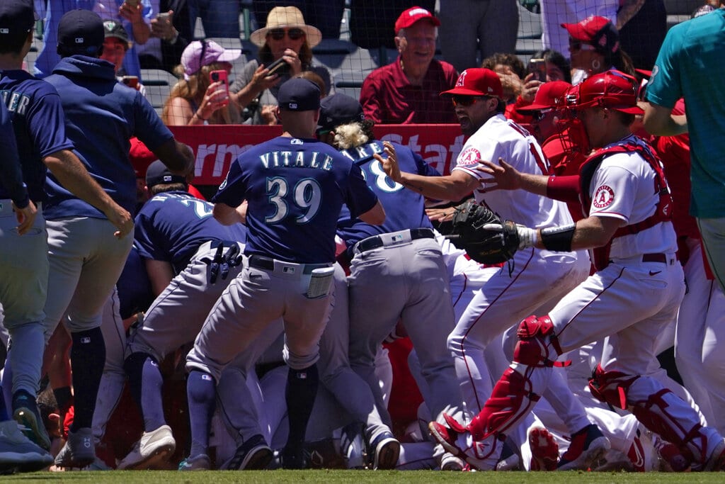 Several members of the Seattle Mariners and the Los Angeles Angels scuffle after Mariners' Jesse Winker was hit by a pitch during the second inning of a baseball game Sunday, June 26, 2022, in Anaheim, Calif. (AP Photo/Mark J. Terrill)