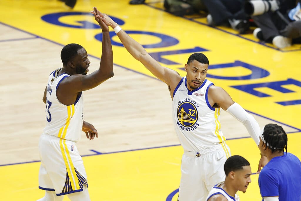 Media by Associated Press - Golden State Warriors forward Draymond Green, left, celebrates with forward Otto Porter Jr. (32) during the first half of Game 1 of basketball's NBA Finals against the Boston Celtics in San Francisco, Thursday, June 2, 2022. (AP Photo/John Hefti)