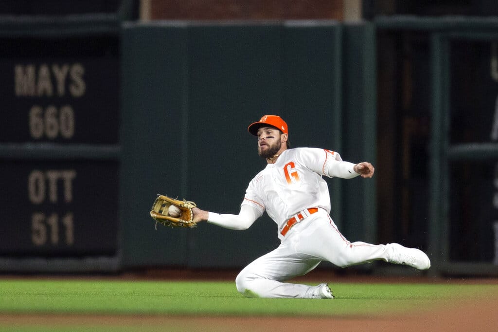 Media by Associated Press - San Francisco Giants right fielder Luis Gonzalez makes a sliding catch of a sinking line drive by Colorado Rockies' José Iglesias during the eighth inning of a baseball game Tuesday, June 7, 2022, in San Francisco. (AP Photo/D. Ross Cameron)