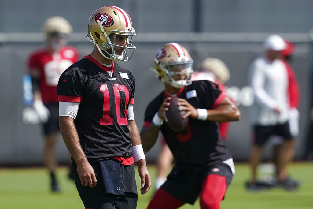 Media by Associated Press - FILE - San Francisco 49ers quarterbacks Jimmy Garoppolo, left, and Trey Lance are shown at NFL football training camp in Santa Clara, Calif., Thursday, July 29, 2021. The 49ers report to training camp with intrigue about what the team plans to do with former starting quarterback Jimmy Garoppolo with Trey Lance set to take his place.(AP Photo/Jeff Chiu, File)