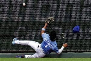 Media by Associated Press - Kansas City Royals right fielder MJ Melendez hits the fence as he tries to catch an RBI triple hit by Los Angeles Angels' Phil Gosselin during the fifth inning of a baseball game Wednesday, July 27, 2022, in Kansas City, Mo. (AP Photo/Charlie Riedel)