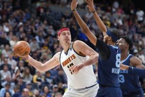 Media by Associated Press - FILE - Denver Nuggets center Nikola Jokic looks to pass the ball as Memphis Grizzlies guard Ziaire Williams, front, and forward Jaren Jackson Jr. defend during the first half of an NBA basketball game April 7, 2022, in Denver. Jokic and the Nuggets agreed Thursday, June 30, to a $264 supermax extension, according to a person with direct knowledge of the negotiations who spoke to The Associated Press on condition of anonymity because neither the player nor team announced the agreement. (AP Photo/David Zalubowski, File)