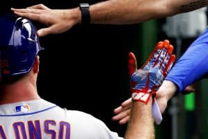 Media by Associated Press - New York Mets' Pete Alonso is congratulated by teammates after hitting a sacrifice fly during the 11th inning in the first baseball game of a doubleheader against the Chicago Cubs in Chicago, Saturday, July 16, 2022. The Mets won 2-1. (AP Photo/Nam Y. Huh)