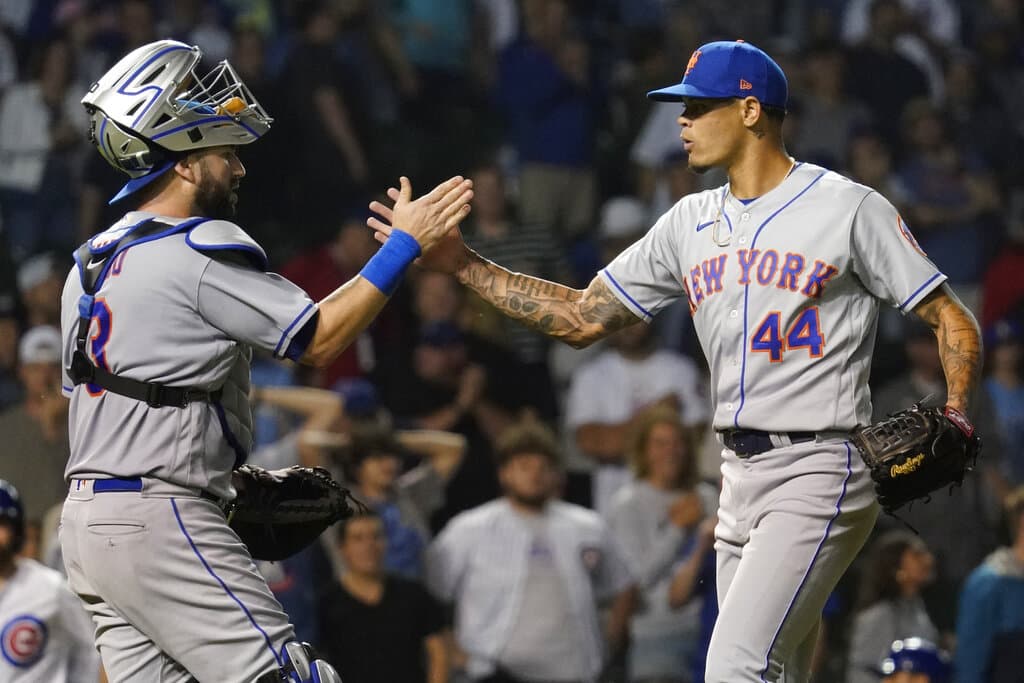 Media by Associated Press - New York Mets catcher Tomas Nido, left, celebrates with relief pitcher Yoan Lopez after the Mets defeated the Chicago Cubs in the second baseball game of a doubleheader in Chicago, Saturday, July 16, 2022. (AP Photo/Nam Y. Huh)