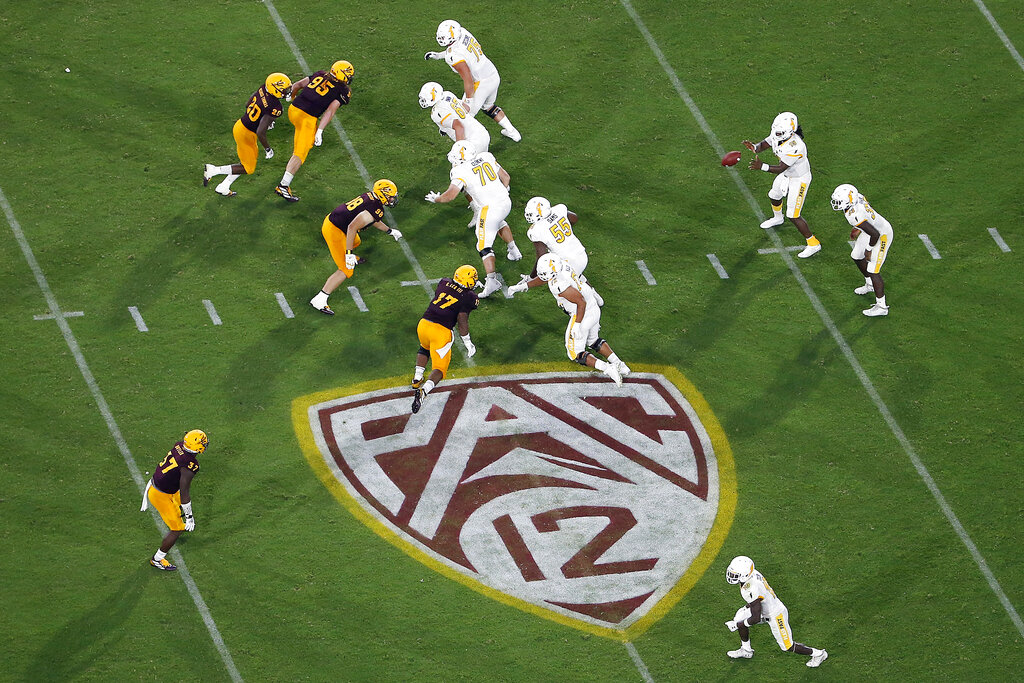 Media by Associated Press - FILE - The Pac-12 logo is shown during the second half of an NCAA college football game between Arizona State and Kent State, in Tempe, Ariz. on Aug. 29, 2019. The Pac-12 announced, Wednesday, May 18, 2022, it was scrapping its divisional format for the coming season Wednesday, May 18, 2022. (AP Photo/Ralph Freso, File)