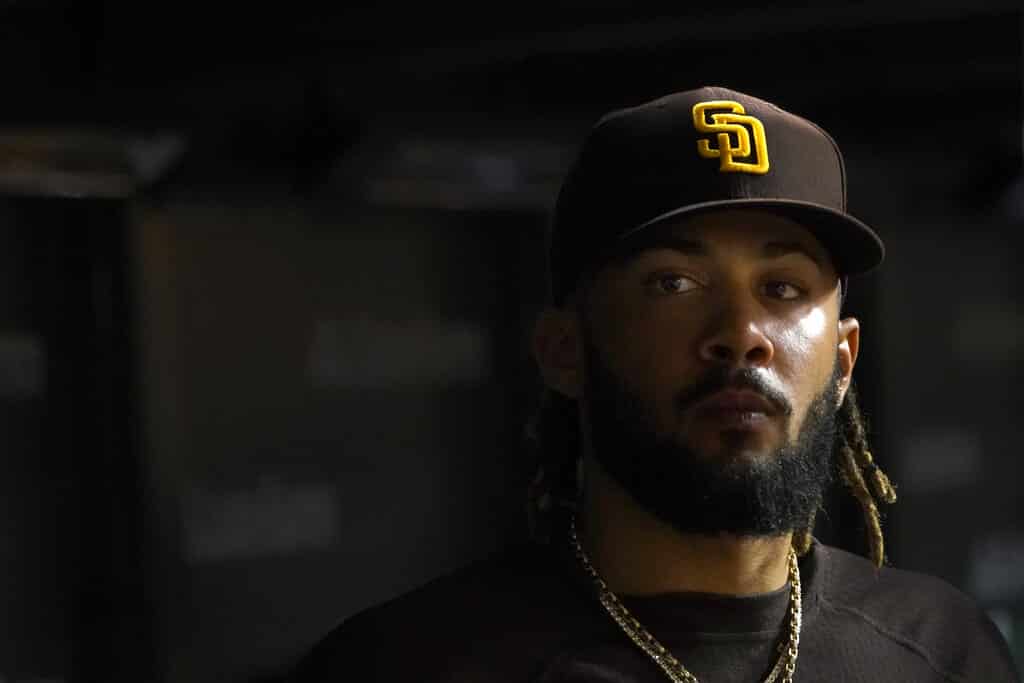 Media by Associated Press - San Diego Padres' Fernando Tatis Jr. looks out of the dugout during the fifth inning of the team's baseball game against the Chicago Cubs on Wednesday, June 15, 2022, in Chicago. (AP Photo/Charles Rex Arbogast)