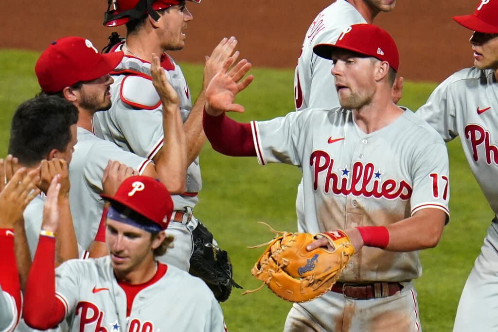 Media by Associated Press - Philadelphia Phillies' Rhys Hoskins (17) and teammates celebrate a 4-2 win over the Pittsburgh Pirates in 10 innings in a baseball game in Pittsburgh, Friday, July 29, 2022. (AP Photo/Gene J. Puskar)