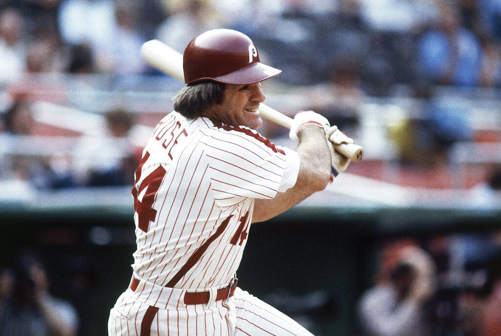 Media by Associated Press - FILE - Philadelphia Phillies' Pete Rose bats during a 1980 baseball game. Rose will make an appearance on the field in Philadelphia next month. Baseball’s career hits leader will be part of Phillies alumni weekend, and will be introduced on the field alongside many former teammates from the 1980 World Series championship team on Aug. 7. (AP Photo, File)