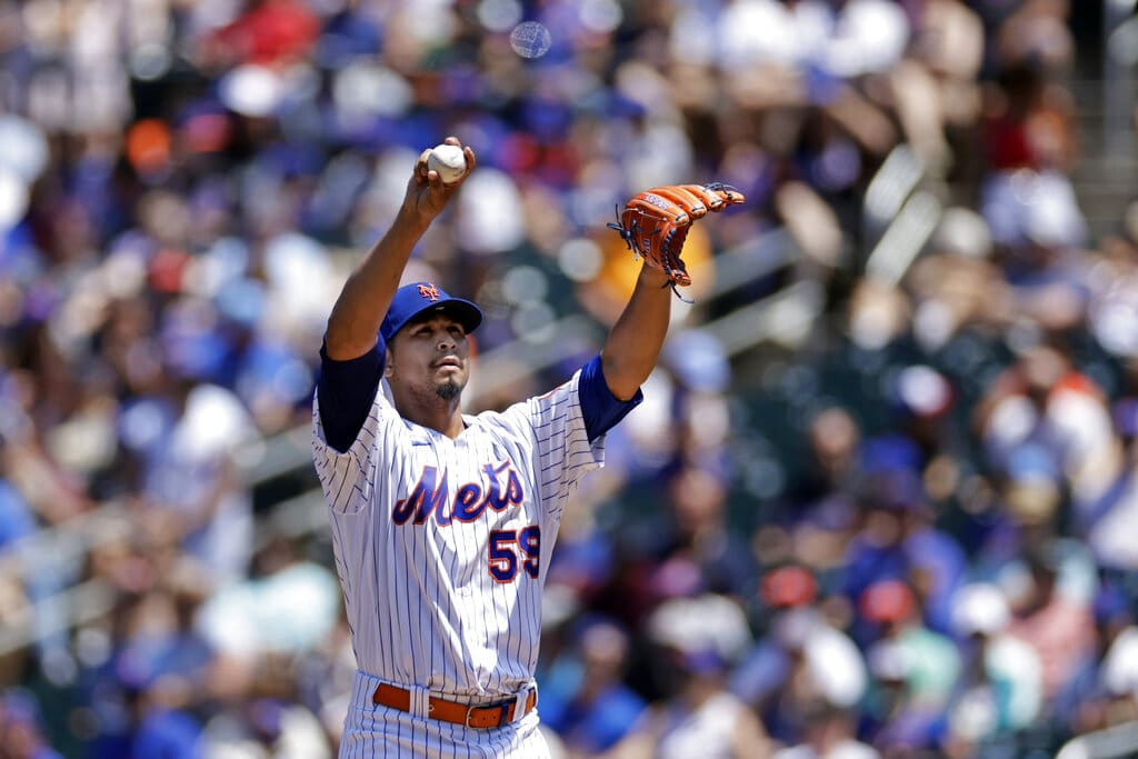 Media by Associated Press - New York Mets pitcher Carlos Carrasco (59) reacts during the first inning of a baseball game against the Texas Rangers on Sunday, July 3, 2022, in New York. (AP Photo/Adam Hunger)