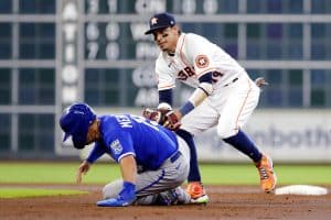 Media by Associated Press - Houston Astros shortstop Mauricio Dubon, right, makes the tag for the out on Kansas City Royals runner Whit Merrifield, left, during the third inning of a baseball game Thursday, July 7, 2022, in Houston. (AP Photo/Michael Wyke)