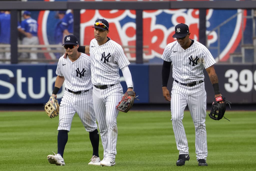 Media by Associated Press - New York Yankees' Andrew Benintendi, left, Marwin Gonzalez, center, and Aaron Hicks celebrate their win after a baseball game against the Toronto Blue Jays, Sunday, Aug. 21, 2022, in New York. (AP Photo/Corey Sipkin)