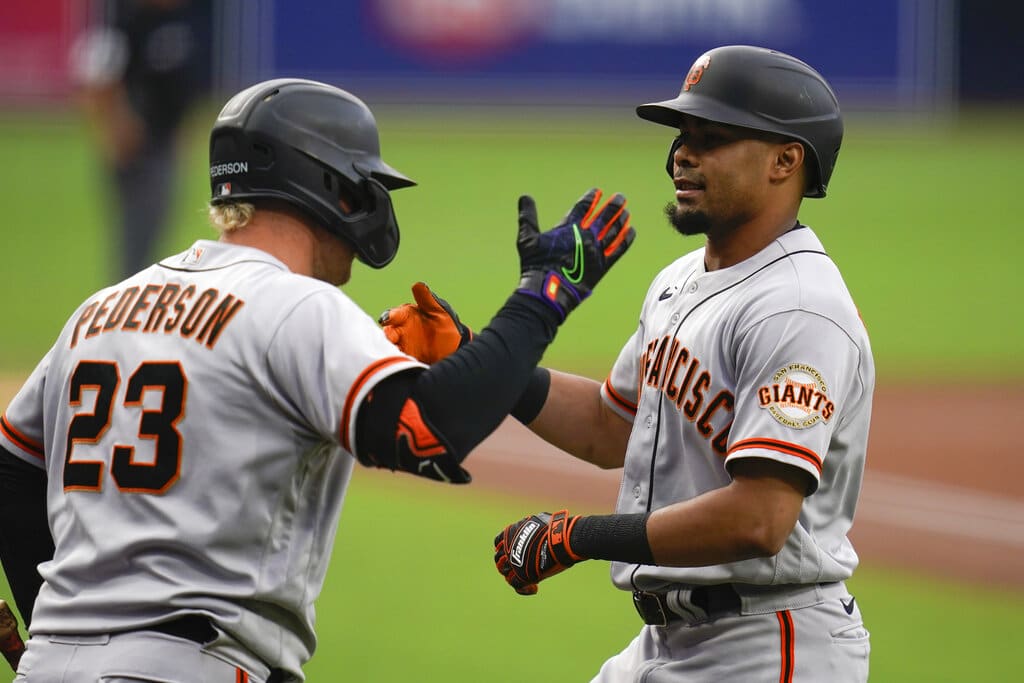 Media by Associated Press - San Francisco Giants' LaMonte Wade Jr., right, celebrates with Joc Pederson after hitting a home run during the first inning of the team's baseball game against the San Diego Padres, Tuesday, Aug. 9, 2022, in San Diego. (AP Photo/Gregory Bull)