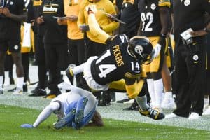 Media by Associated Press - Pittsburgh Steelers wide receiver George Pickens (14) tumbles over a Detroit Lions defender after making a catch during the first half of an NFL preseason football game, Sunday, Aug. 28, 2022, in Pittsburgh. (AP Photo/Fred Vuich)