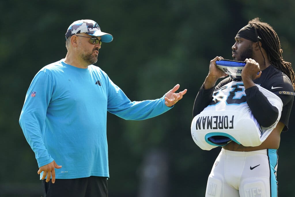 Media by Associated Press - Carolina Panthers' head coach Matt Rhule talks with D'Onta Foreman during the NFL football team's training camp at Wofford College on Wednesday, Aug. 3, 2022, in Spartanburg, S.C. (AP Photo/Chris Carlson)