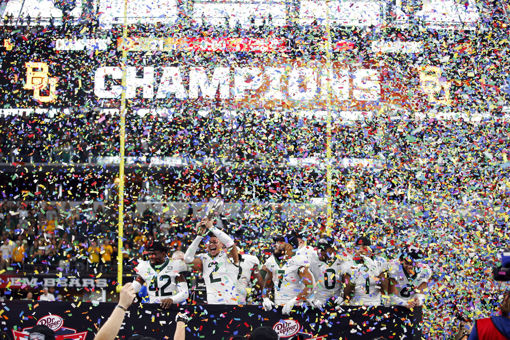 Media by Associated Press - Baylor safety Jairon McVea (42), linebacker Terrel Bernard (2), running back Abram Smith (7), wide receiver R.J. Sneed (0) running back Trestan Ebner (1) and safety Jalen Pitre (8) celebrate with the trophy after defeating Oklahoma State in an NCAA college football game for the Big 12 Conference championship in Arlington, Texas, Dec. 4, 2021. Baylor has been tabbed as the preseason favorite to win the conference title again, based on a poll of media who cover the league. It is the first time Baylor has ever been favored in the preseason vote. Coach Dave Aranda's Bears got 17 of the 41 first-place votes in the poll released Thursday, July 7, 2022. (AP Photo/Tim Heitman, file)