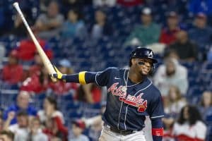 Media by Associated Press - Atlanta Braves's Ronald Acuna Jr. celebrates after scoring on an RBI single by Michael Harris II during the 11th inning of a baseball game against the Philadelphia Phillies, Sunday, Sept. 25, 2022, in Philadelphia. (AP Photo/Laurence Kesterson)