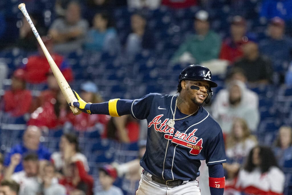 Media by Associated Press - Atlanta Braves's Ronald Acuna Jr. celebrates after scoring on an RBI single by Michael Harris II during the 11th inning of a baseball game against the Philadelphia Phillies, Sunday, Sept. 25, 2022, in Philadelphia. (AP Photo/Laurence Kesterson)