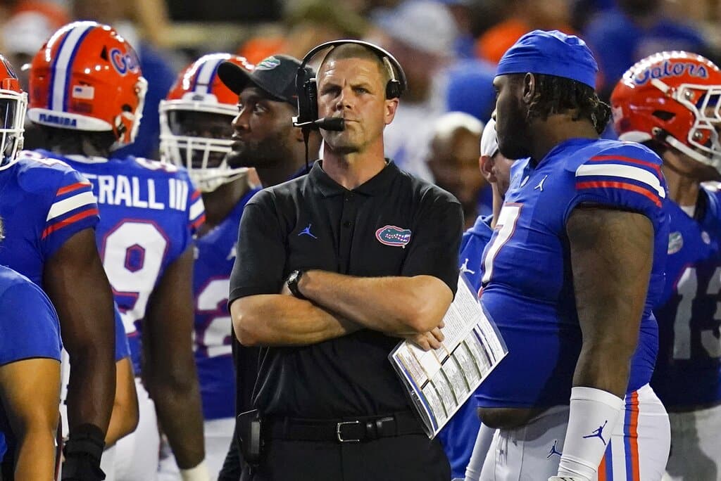 Media by Associated Press - Florida head coach Billy Napier stands next to his players during a timeout in the final minutes of an NCAA college football game against Kentucky, Saturday, Sept. 10, 2022, in Gainesville, Fla. (AP Photo/John Raoux)