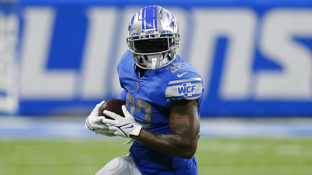 Media by Associated Press - Detroit Lions running back D'Andre Swift (32) runs the ball against the Philadelphia Eagles in the second half of an NFL football game in Detroit, Sunday, Sept. 11, 2022. (AP Photo/Duane Burleson)