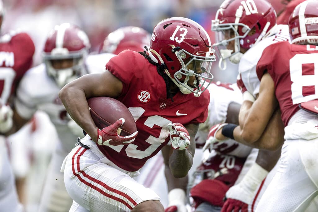 Media by Associated Press - FILE - Alabama running back Jahmyr Gibbs (13) runs the ball during the first half of Alabama's A-Day NCAA college football scrimmage on April 16, 2022, in Tuscaloosa, Ala. Gibbs gained 5.2 yards per carry each of his two seasons at Georgia Tech and had a combined 1,206 yards rushing and 773 yards receiving during that stretch. He now figures to have a featured role for Alabama, which had two running backs selected in the first round and two more taken in the third round over the last four drafts. (AP Photo/Vasha Hunt, File)