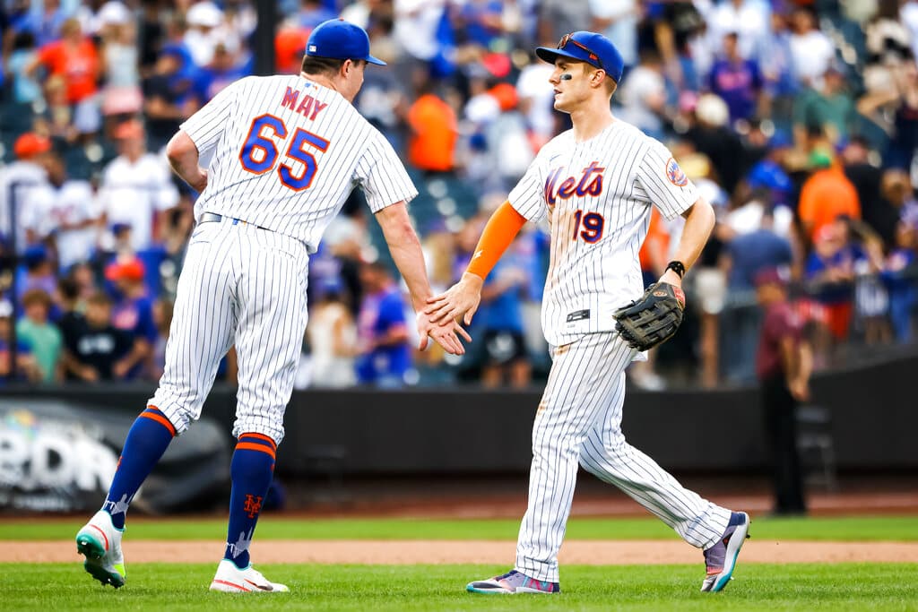 Media by Associated Press - New York Mets' relief pitcher Trevor Maylow-fives first baseman Pete Alonso after they defeated the Pittsburgh Pirates in a baseball game, Sunday, Sept. 18, 2022, in New York. (AP Photo/Julia Nikhinson)