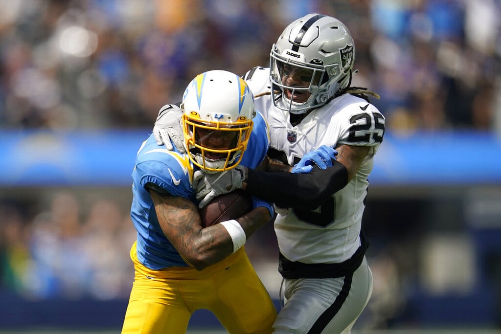 Media by Associated Press - Los Angeles Chargers wide receiver Keenan Allen, left, runs against Las Vegas Raiders safety Tre'von Moehrig (25) during an NFL football game in Inglewood, Calif., Sunday, Sept. 11, 2022. (AP Photo/Marcio Jose Sanchez)