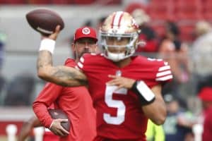 Media by Associated Press - San Francisco 49ers head coach Kyle Shanahan looks on as San Francisco 49ers quarterback Trey Lance (5) warms up before an NFL football game against the Seattle Seahawks, Sunday, Sept. 18, 2022 in Santa Clara, Calif. (AP Photo/Lachlan Cunningham)