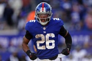 Media by Associated Press - New York Giants running back Saquon Barkley (26) runs with the ball against the Baltimore Ravens during an NFL football game Sunday, Oct. 16, 2022, in East Rutherford, N.J. (AP Photo/Adam Hunger)