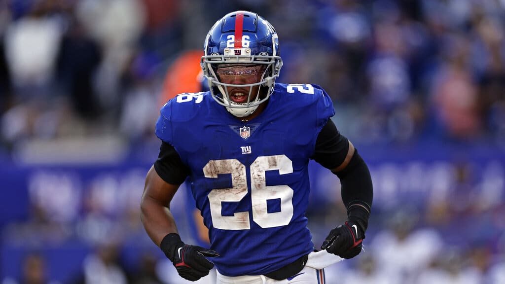 Media by Associated Press - New York Giants running back Saquon Barkley (26) runs with the ball against the Baltimore Ravens during an NFL football game Sunday, Oct. 16, 2022, in East Rutherford, N.J. (AP Photo/Adam Hunger)