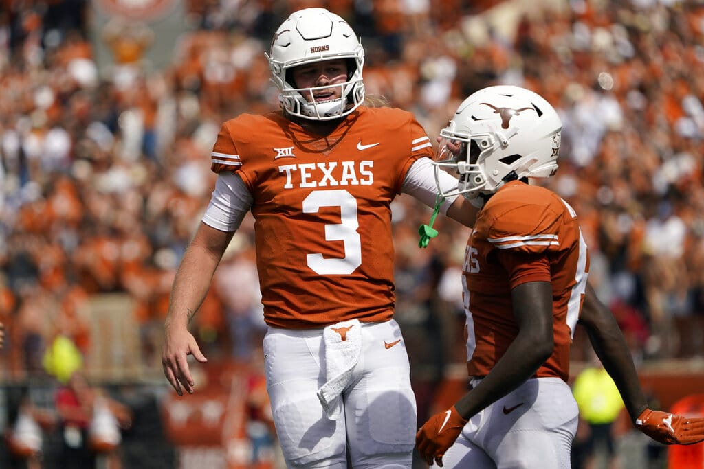 Media by Associated Press - Texas quarterback Quinn Ewers (3) and wide receiver Xavier Worthy (8) celebrate a score against Iowa State second half of an NCAA college football game, Saturday, Oct. 15, 2022, in Austin, Texas. (AP Photo/Eric Gay)