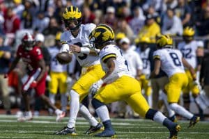 Media by Associated Press - Michigan quarterback J.J. McCarthy (9) hands off to running back Blake Corum (2) during an NCAA college football game, Saturday, Oct. 8, 2022, in Bloomington, Ind. (AP Photo/Doug McSchooler)