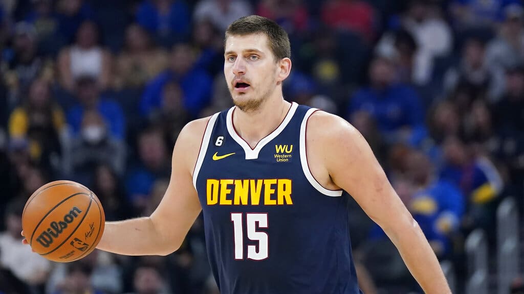 Media by Associated Press - Denver Nuggets center Nikola Jokic against the Golden State Warriors during an NBA preseason basketball game in San Francisco, Friday, Oct. 14, 2022. (AP Photo/Jeff Chiu)