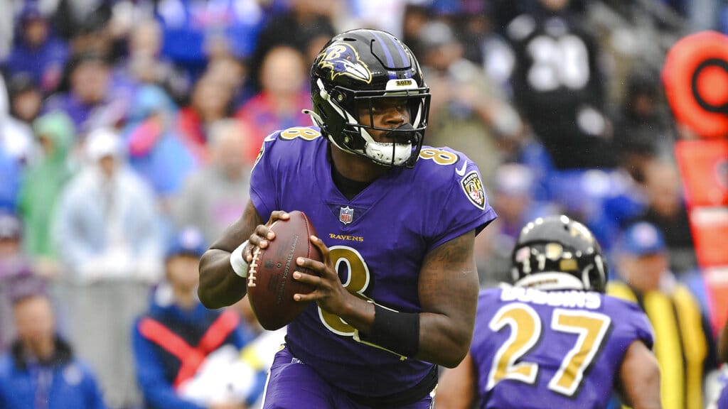 Media by Associated Press - Baltimore Ravens quarterback Lamar Jackson (8) looks to pass the ball during the first half of a NFL football game against the Buffalo Bills, Sunday, Oct. 2, 2022, in Baltimore. (AP Photo/Terrance Williams)