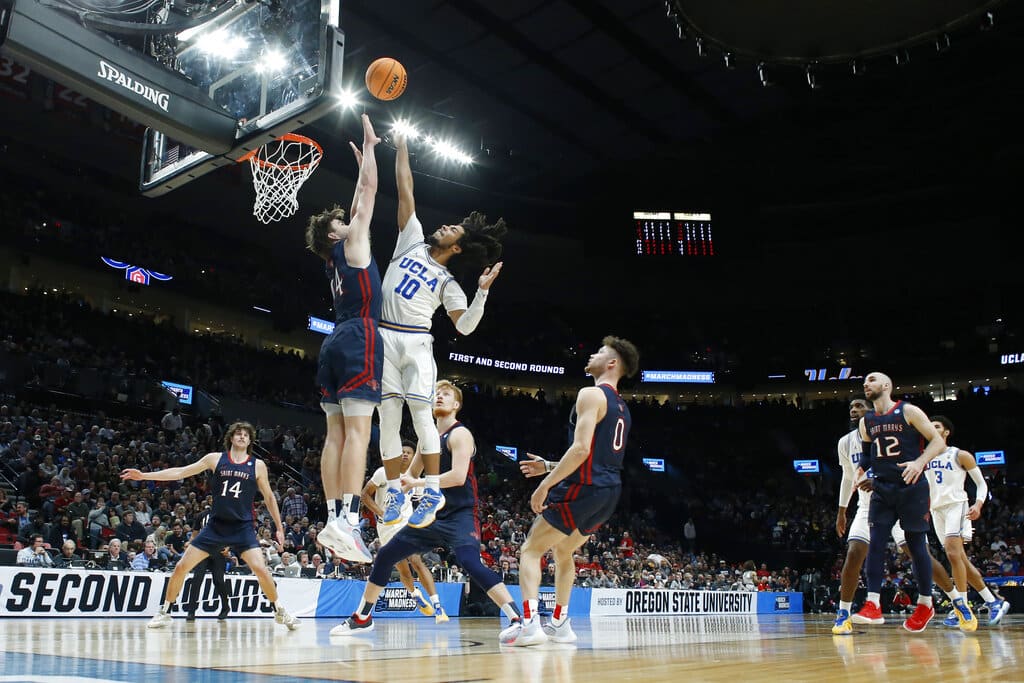 Media by Associated Press - FILE - UCLA guard Tyger Campbell (10) puts up a shot during the second half of a second-round NCAA college basketball tournament game against Saint Mary's College on March 19, 2022, in Portland, Ore. Campbell and Jaime Jaquez Jr. are back for their fourth seasons, a couple of battle-tested veterans who arrived at the same time as coach Mick Cronin to rebuild a program that owns a record 11 national championships. UCLA opens the season at home with two new five-star recruits against Sacramento State on Nov. 7. (AP Photo/Craig Mitchelldyer, File)