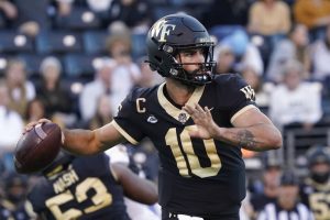 Media by Associated Press - Wake Forest quarterback Sam Hartman (10) looks to pass against Boston College during the second half of an NCAA college football game in Winston-Salem, N.C., Saturday, Oct. 22, 2022. (AP Photo/Chuck Burton)