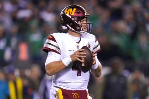 Media by Associated Press - Washington Commanders quarterback Taylor Heinicke in action during an NFL football game, Monday, Nov. 14, 2022, in Philadelphia. (AP Photo/Matt Rourke)