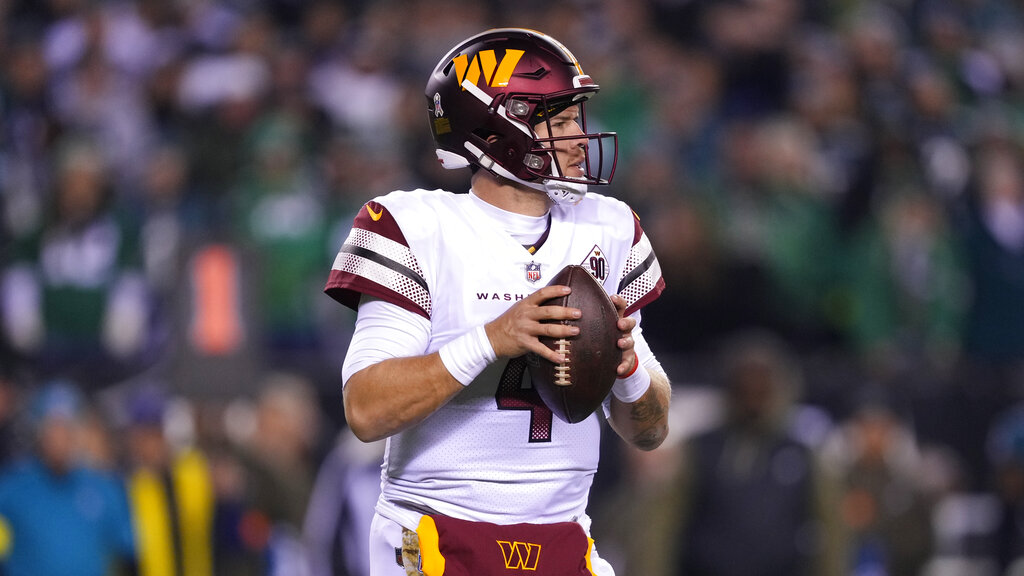 Media by Associated Press - Washington Commanders quarterback Taylor Heinicke in action during an NFL football game, Monday, Nov. 14, 2022, in Philadelphia. (AP Photo/Matt Rourke)