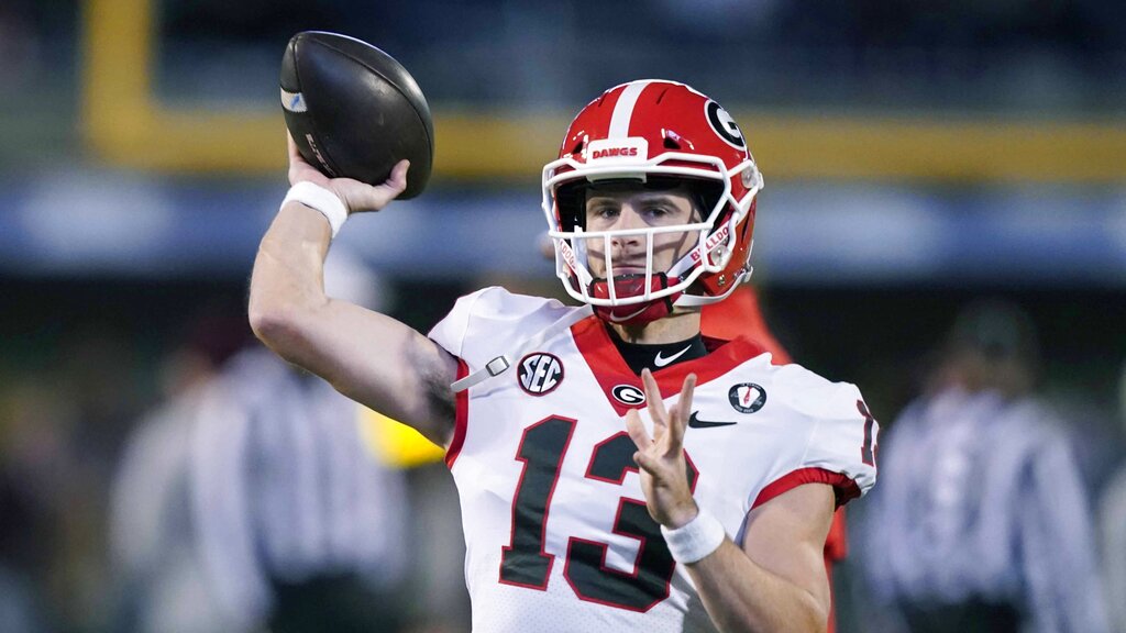 Media by Associated Press - Georgia quarterback Stetson Bennett (13) tosses a pass during warmups prior to an NCAA college football game against Mississippi State in Starkville, Miss., Saturday, Nov. 12, 2022. Georgia won 45-19. (AP Photo/Rogelio V. Solis)