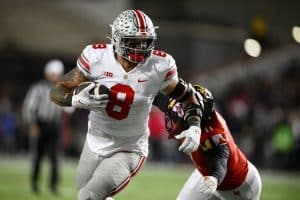 Media by Associated Press - Ohio State tight end Cade Stover (8) runs with the ball past Maryland linebacker Ruben Hyppolite II (11) during the second half of an NCAA college football game, Saturday, Nov. 19, 2022, in College Park, Md. Ohio State won 43-30. (AP Photo/Nick Wass)