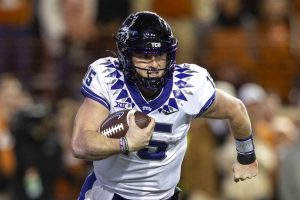 Media by Associated Press - TCU quarterback Max Duggan (15) scrambles against Texas during the second half of an NCAA college football game Saturday, Nov. 12, 2022, in Austin, Texas. (AP Photo/Stephen Spillman)