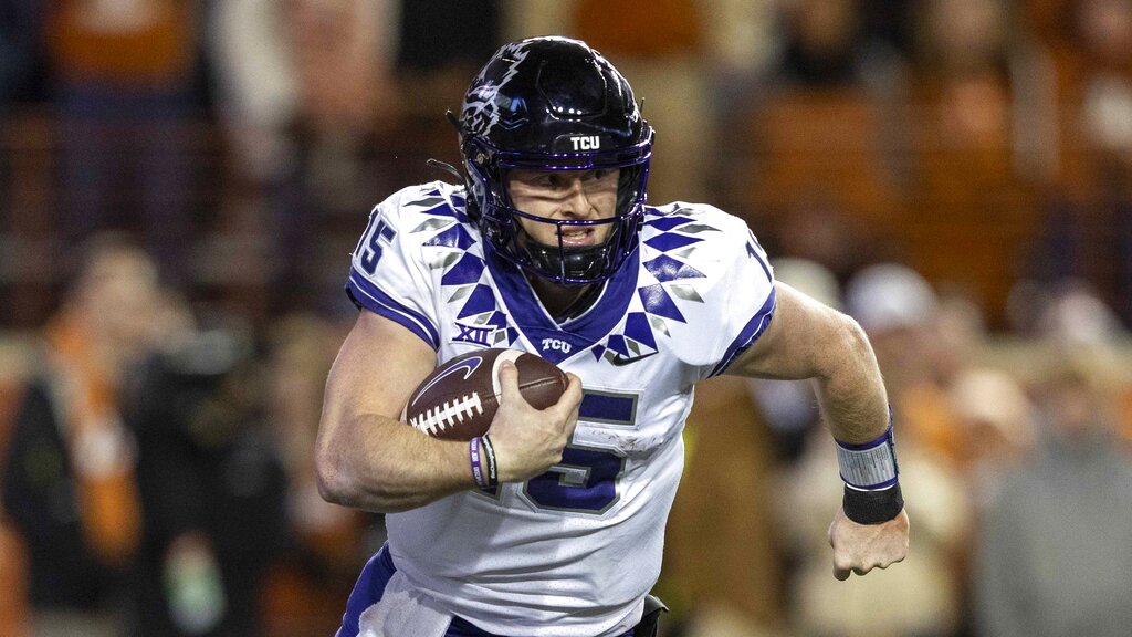 Media by Associated Press - TCU quarterback Max Duggan (15) scrambles against Texas during the second half of an NCAA college football game Saturday, Nov. 12, 2022, in Austin, Texas. (AP Photo/Stephen Spillman)