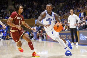 Media by Associated Press - Duke's Dariq Whitehead (0) drives against Boston College's DeMarr Langford Jr. (5) during the first half of an NCAA college basketball game in Durham, N.C., Saturday, Dec. 3, 2022. (AP Photo/Ben McKeown)