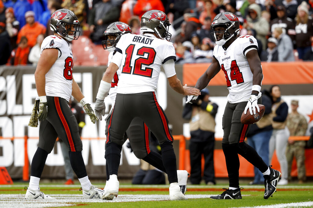 Media by Associated Press - Tampa Bay Buccaneers quarterback Tom Brady (12) congratulates wide receiver Chris Godwin (14) after scoring a touchdown during an NFL football game against the Cleveland Browns, Sunday, Nov. 27, 2022, in Cleveland. (AP Photo/Kirk Irwin)