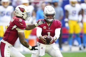 Media by Associated Press - Arizona Cardinals quarterback Kyler Murray, right, hands the ball off to Cardinals running back James Conner (6) during the first half of an NFL football game against the Los Angeles Chargers in Glendale, Ariz., Sunday, Nov. 27, 2022. The Chargers won 25-24. (AP Photo/Ross D. Franklin)