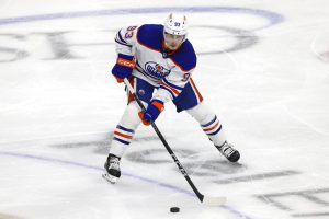 Media by Associated Press - Edmonton Oilers center Ryan Nugent-Hopkins (93) handles the puck during the third period of an NHL hockey game against the Minnesota Wild, Thursday, Dec. 1, 2022, in St. Paul, Minn. Minnesota won 5-3. (AP Photo/Stacy Bengs)