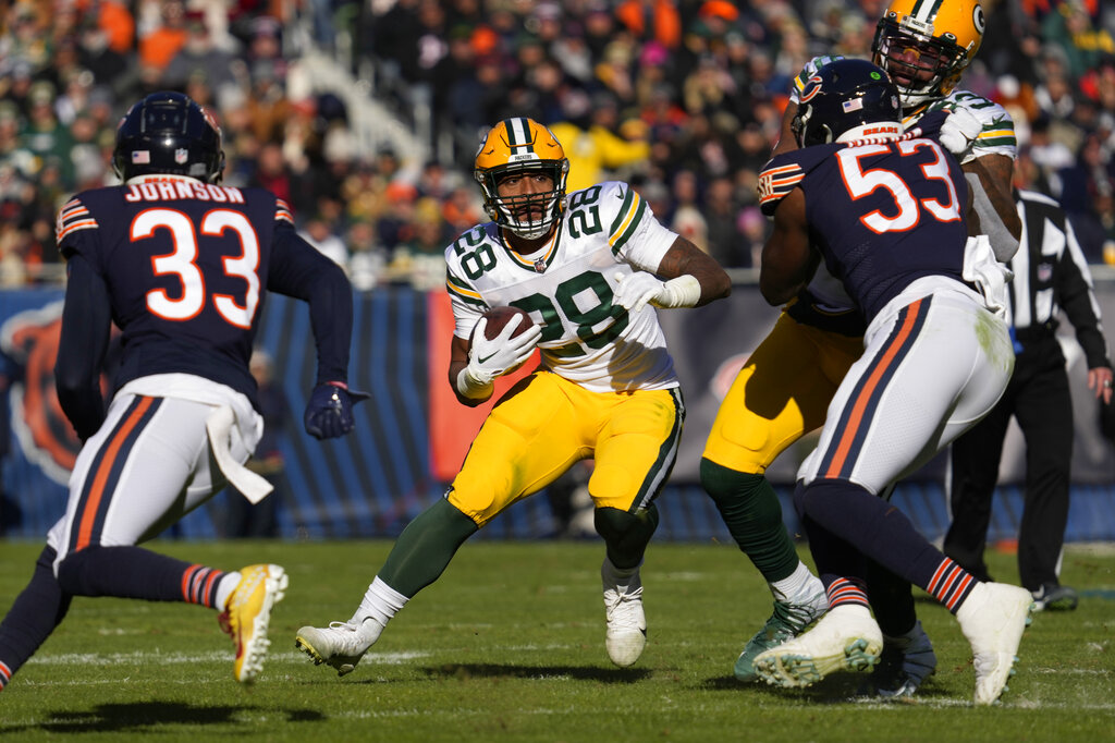 Media by Associated Press - Green Bay Packers running back AJ Dillon (28) runs against the Chicago Bears during the first half of an NFL football game, Sunday, Dec. 4, 2022, in Chicago. (AP Photo/Nam Y. Huh)