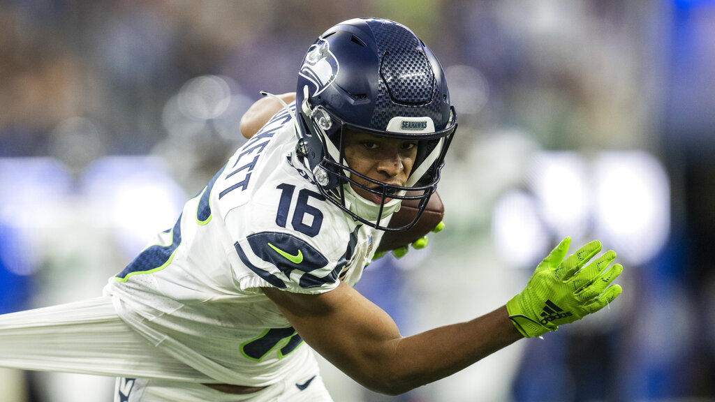 Media by Associated Press - Seattle Seahawks wide receiver Tyler Lockett (16) runs with the ball during an NFL football game against the Los Angeles Rams, Sunday, Dec. 4, 2022, in Inglewood, Calif. (AP Photo/Kyusung Gong)