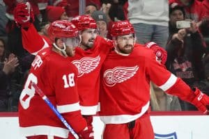 Detroit Red Wings defenseman Filip Hronek, right, celebrates his goal; with Dylan Larkin, and Andrew Copp (18) in the second period of an NHL hockey game against the Ottawa Senators Saturday, Dec. 17, 2022, in Detroit. (AP Photo/Paul Sancya) - Media by Associated Press